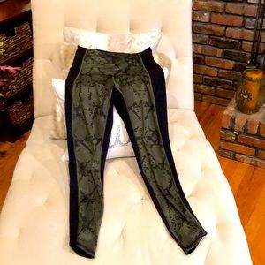 Lululemon leggings, sz 6, green front detail with perforated sides. Great cond.